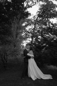 bride and groom kissing in a fine art wedding portrait
