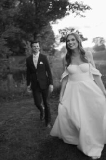 bride and groom walking with a little bit of artistic motion blur