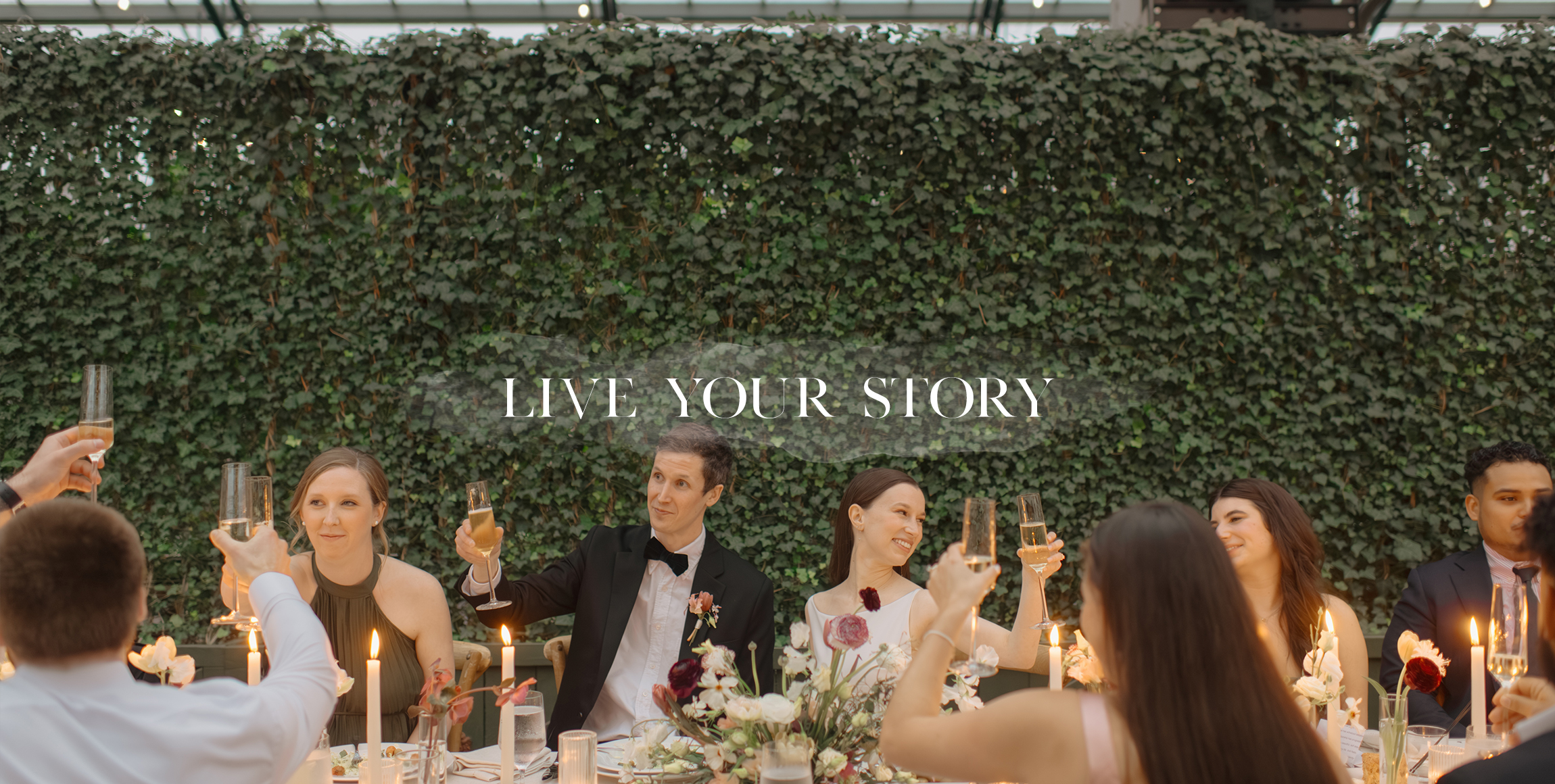 Bride and groom raising a glass after a toast by luxury wedding photographer Heather Jowett