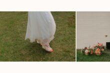 a wedding floral arrangement with a small bird darting through the photo