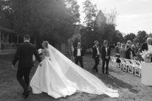 Emotional ceremony moments photographed outdoors in Petoskey with a refined editorial wedding style