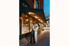 Nighttime wedding portrait in downtown Detroit outside the Shinola Hotel