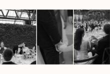 bride and groom moving through the crowd holding hands.