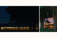 Scene setting shot of a tent set up for a wedding reception at night.